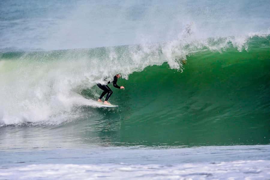 Auckland: Group Surfing Lesson with Muriwai Surf School - Booking flexibility and timing