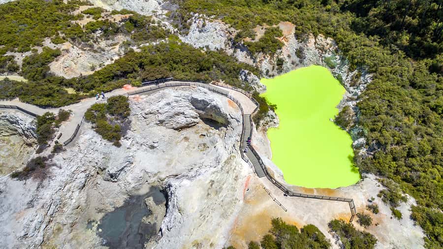 Auckland: Hobbiton, Rotorua and Wai-O-Tapu Day Tour - Wai-O-Tapu’s colored pools and sulfur air