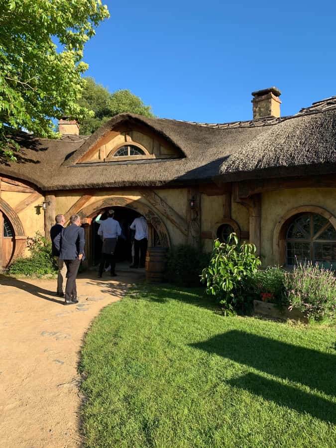 From Auckland: Hobbiton Movie Set - Private Tour - Walking among Hobbit Holes and gardens