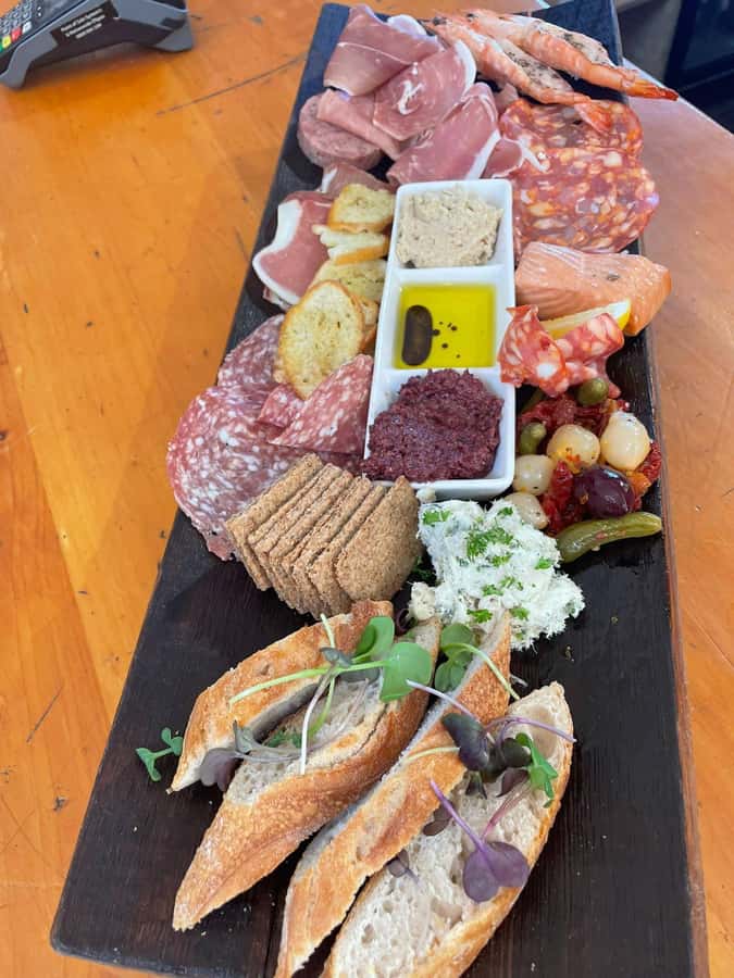 Waiheke: Scenic Taste and Graze Tour with Wine, Whisky, Beer - Mudbrick: wine with a view back to Auckland