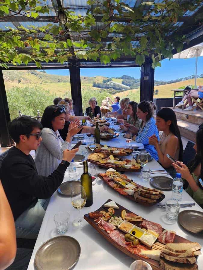 Waiheke: Scenic Taste and Graze Tour with Wine, Whisky, Beer - The scenic drive through Oneroa and Onetangi
