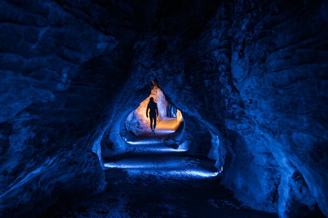 Waitomo Glowworm & Ruakuri Twin Cave - Private Tour From Auckland - Entering Waitomo Glowworm Cave by boat